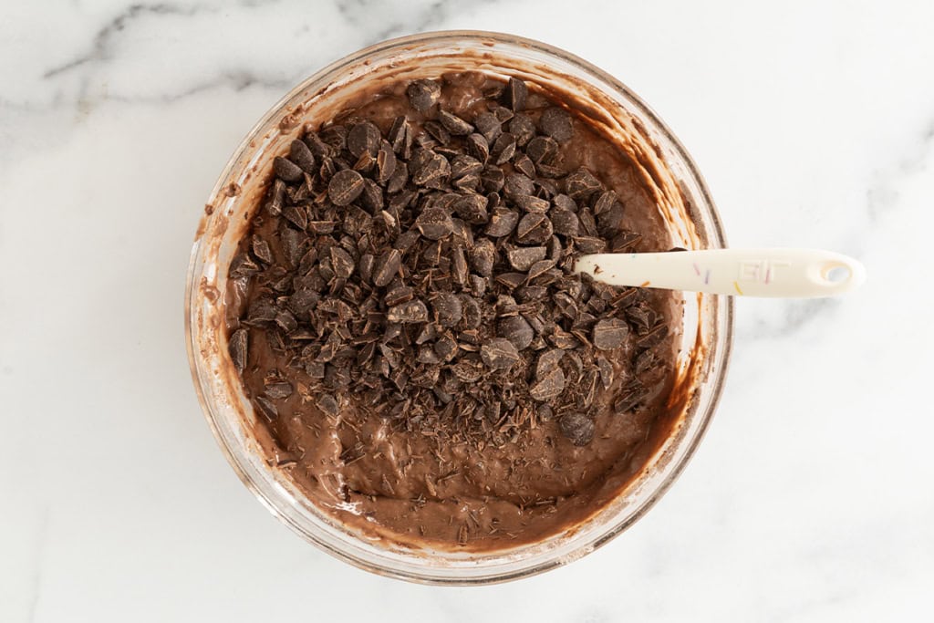 Batter for double chocolate muffins in glass bowl.