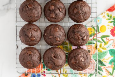 Double chocolate muffins on cooling rack.