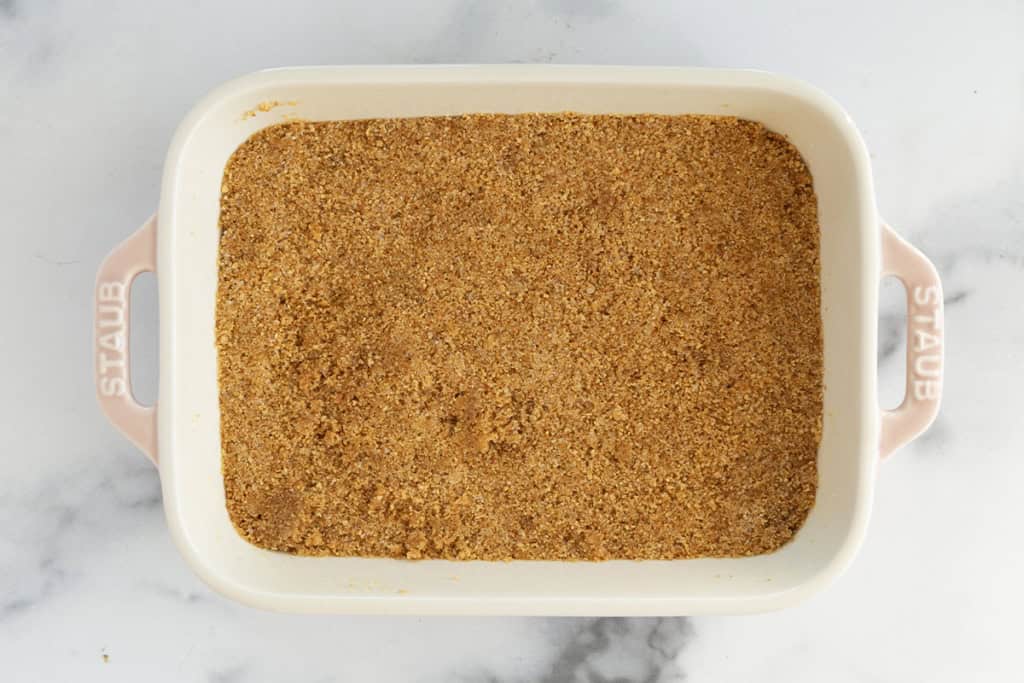 Graham cracker crumbs in pan for no-bake cheesecake.