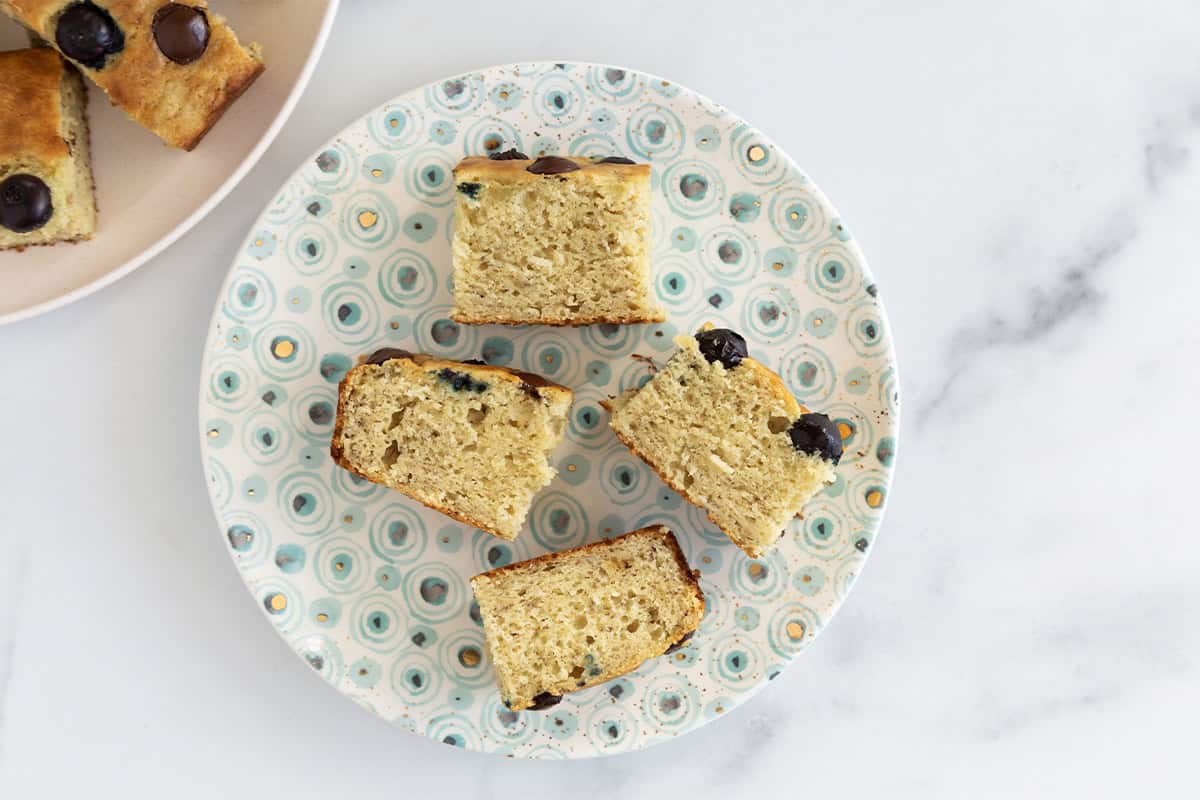 Snack cake slices on spotted plate.