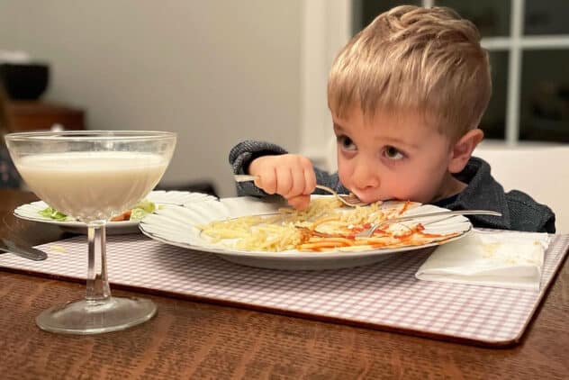 toddler eating pasta.