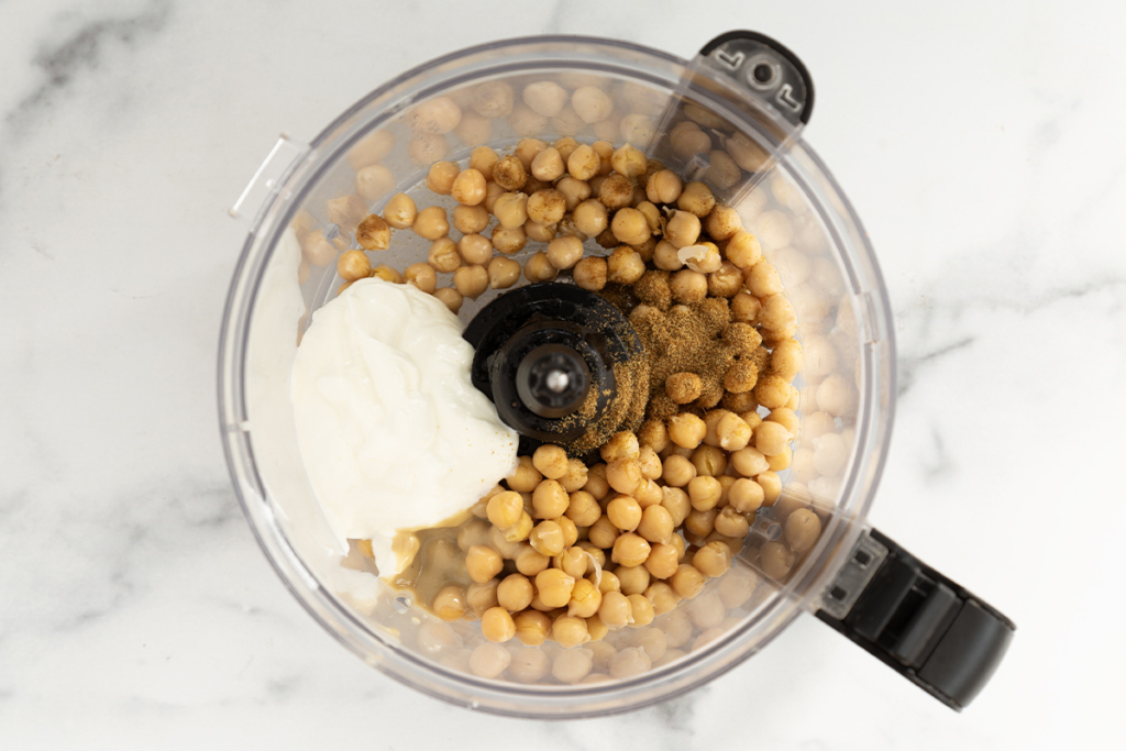 Ingredients for baby hummus in food processor.