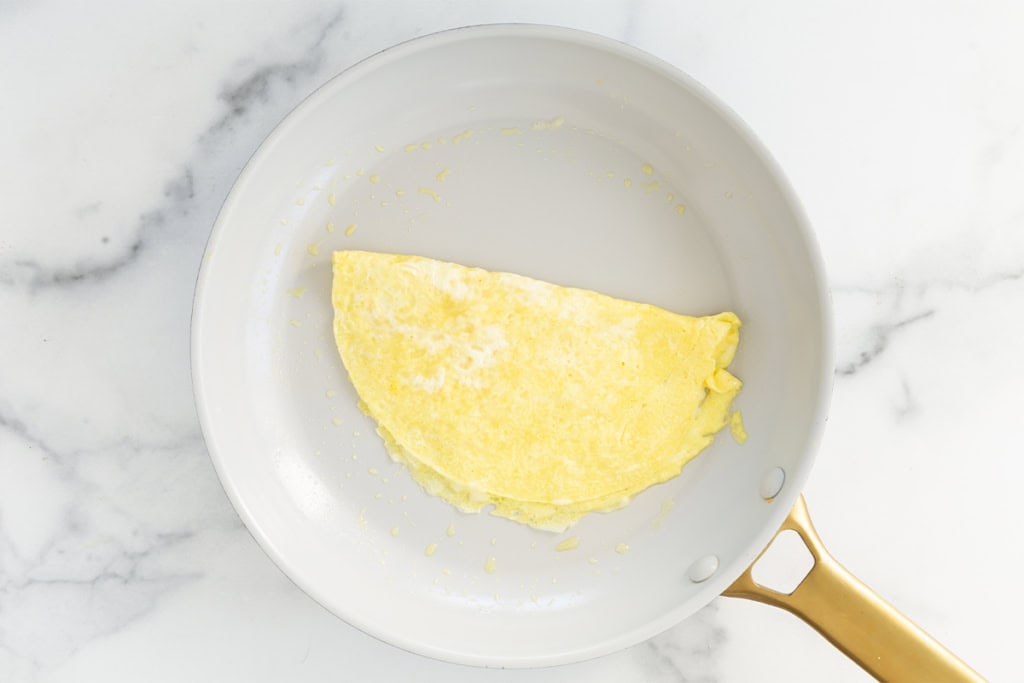 Baby omelette in pan.