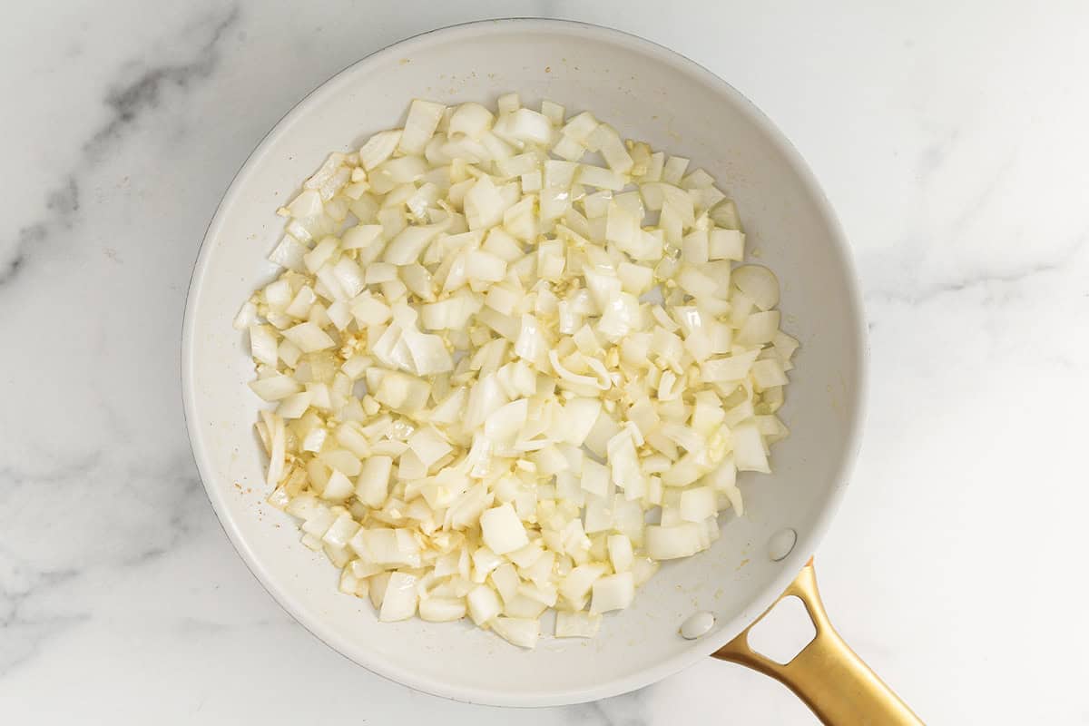 Onion and garlic in pan for butternut squash pasta sauce.