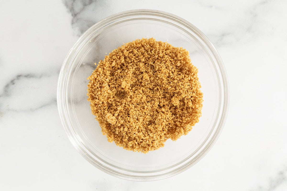 graham cracker crumbs in bowl for Greek yogurt cheesecake