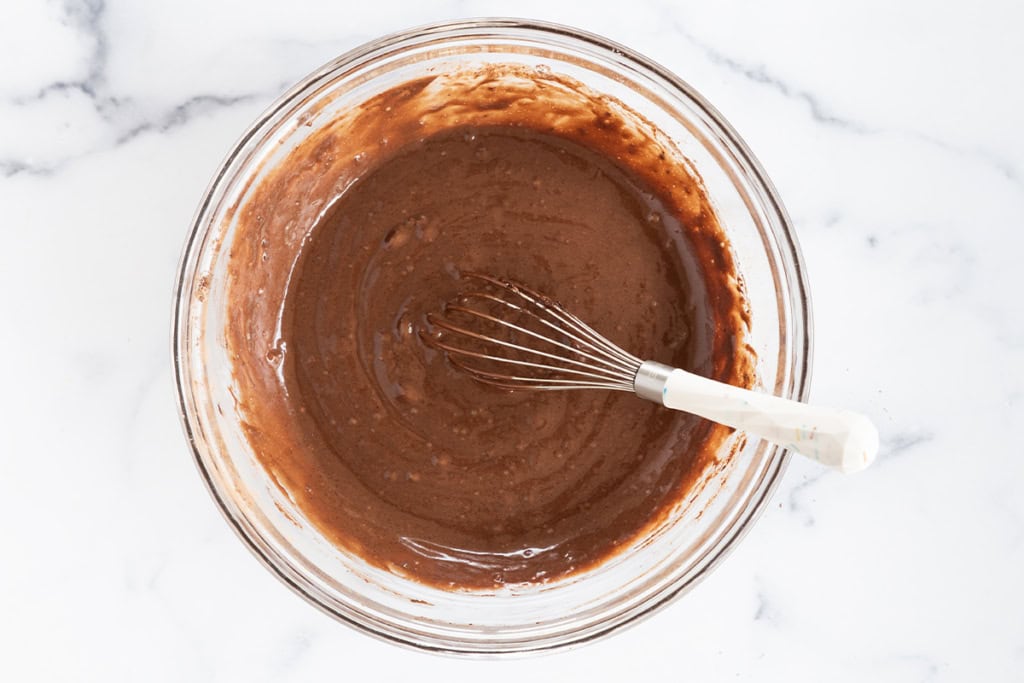 Batter for vegan chocolate cupcakes in glass bowl.