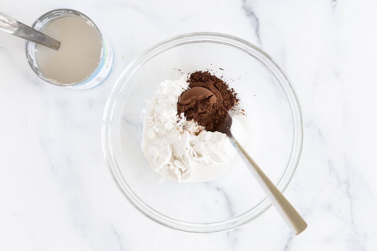 Ingredients for vegan mousse in glass bowl before mixing. 