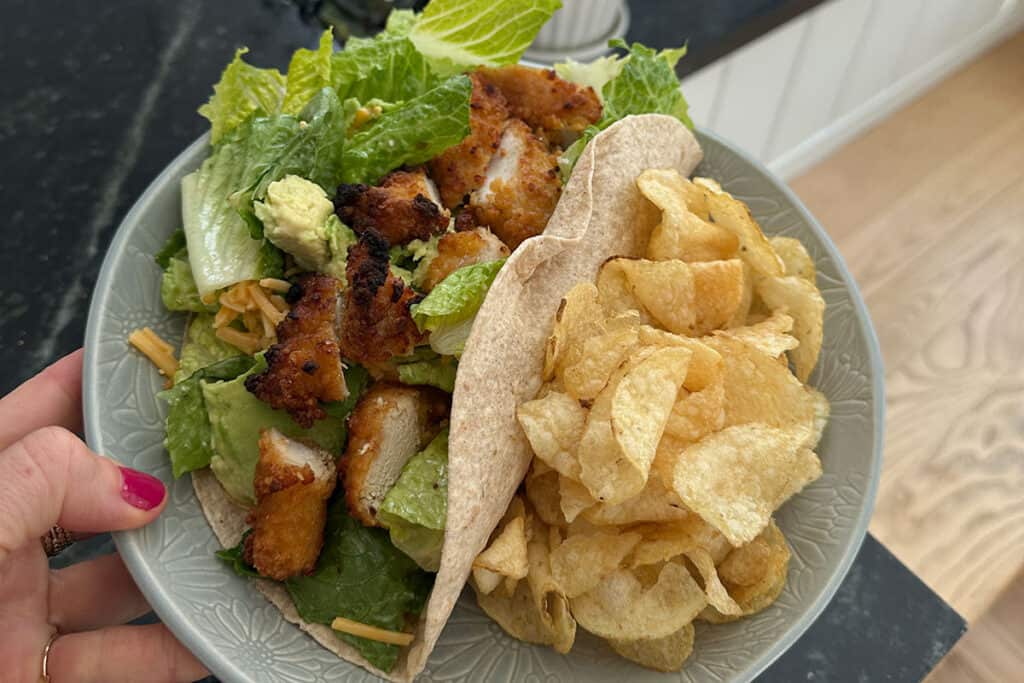 chicken salad wrap with chips.