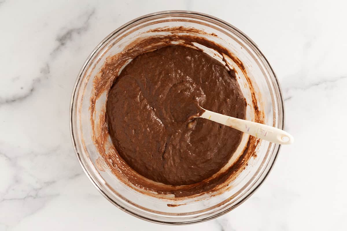 Chocolate snack cake batter in glass bowl.