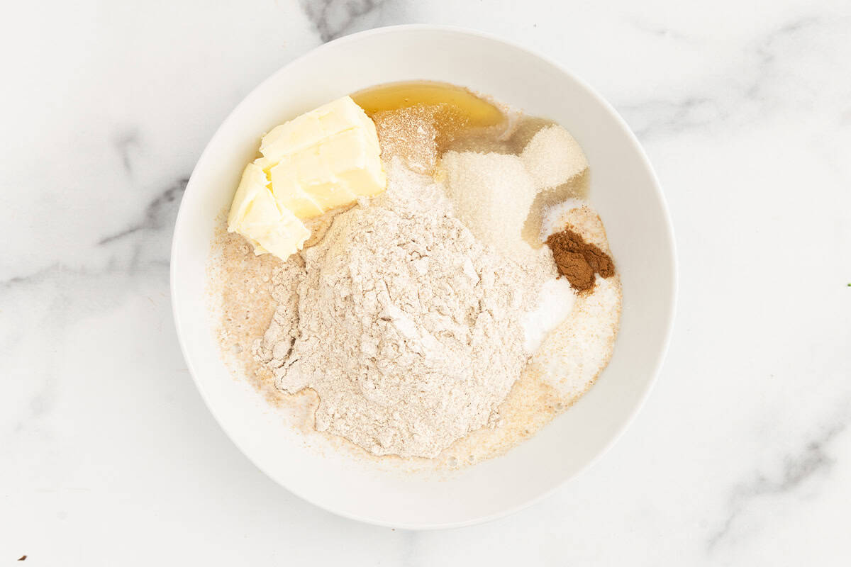 Ingredients for graham crackers in glass bowl before stirring. 