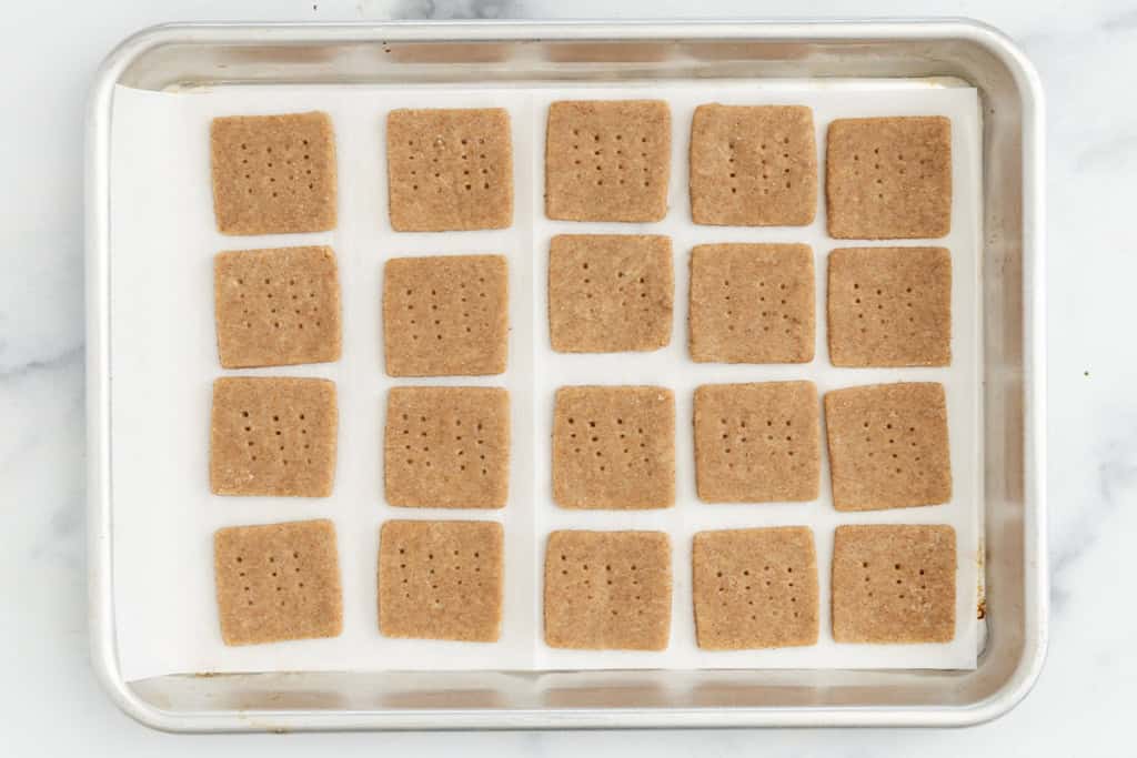 Graham crackers on baking pan before baking.